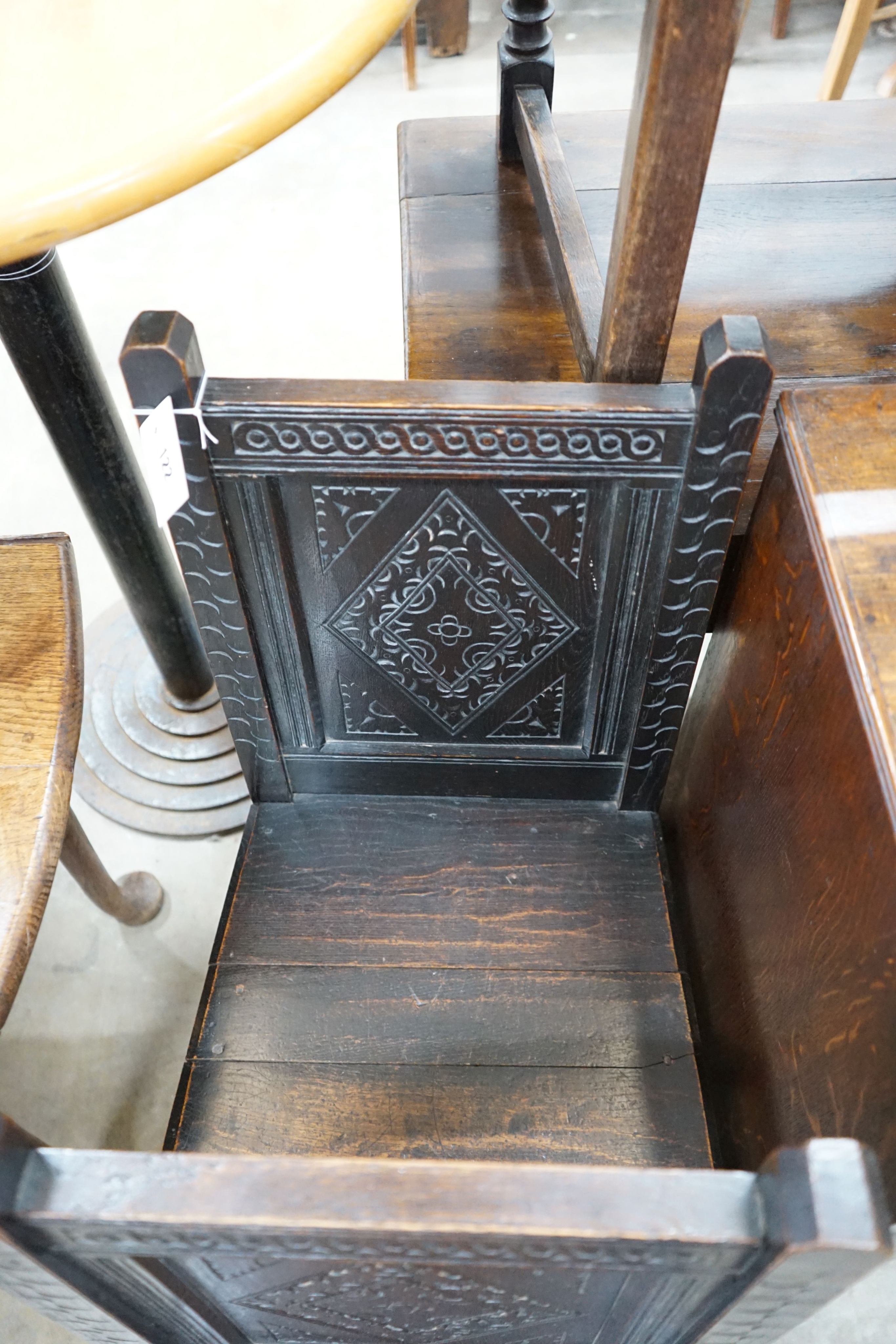 A pair of late Victorian 17th century style carved oak side chairs